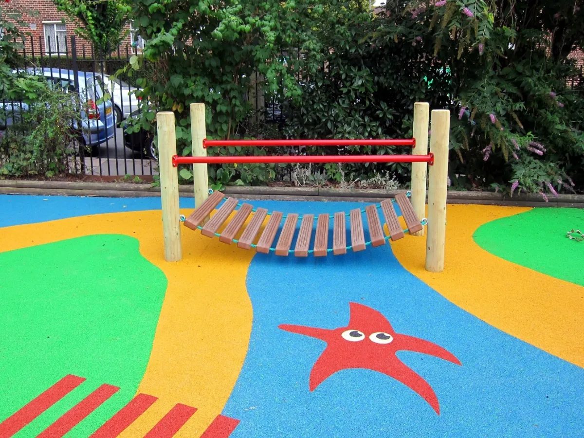 Colourful wet-pour rubber play surface with starfish graphic